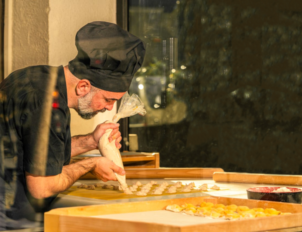 Picture of baker through shop window.